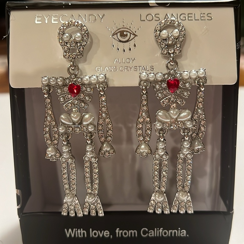 NIB Eye candy skeleton earrings